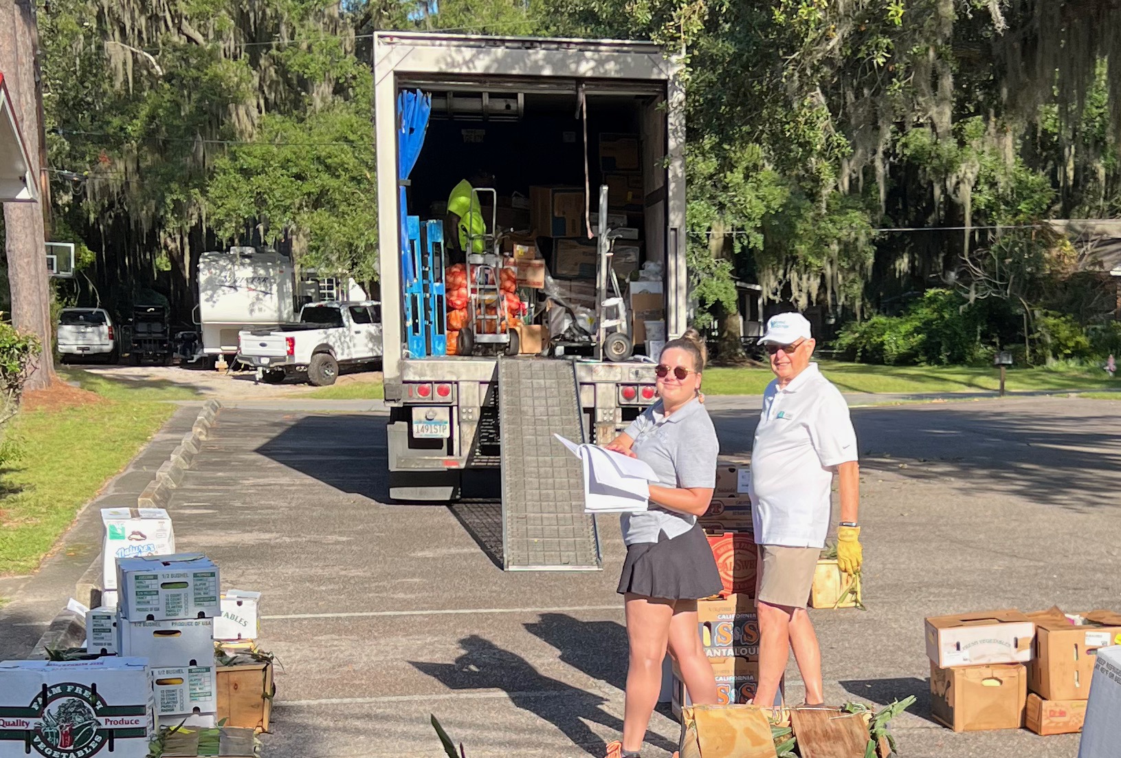 Second Helpings Operations Administrator Leah Long and Board Member Bob Taylor unloading and distributing 5,000 pounds of healthy food for Beaufort-area agencies.
